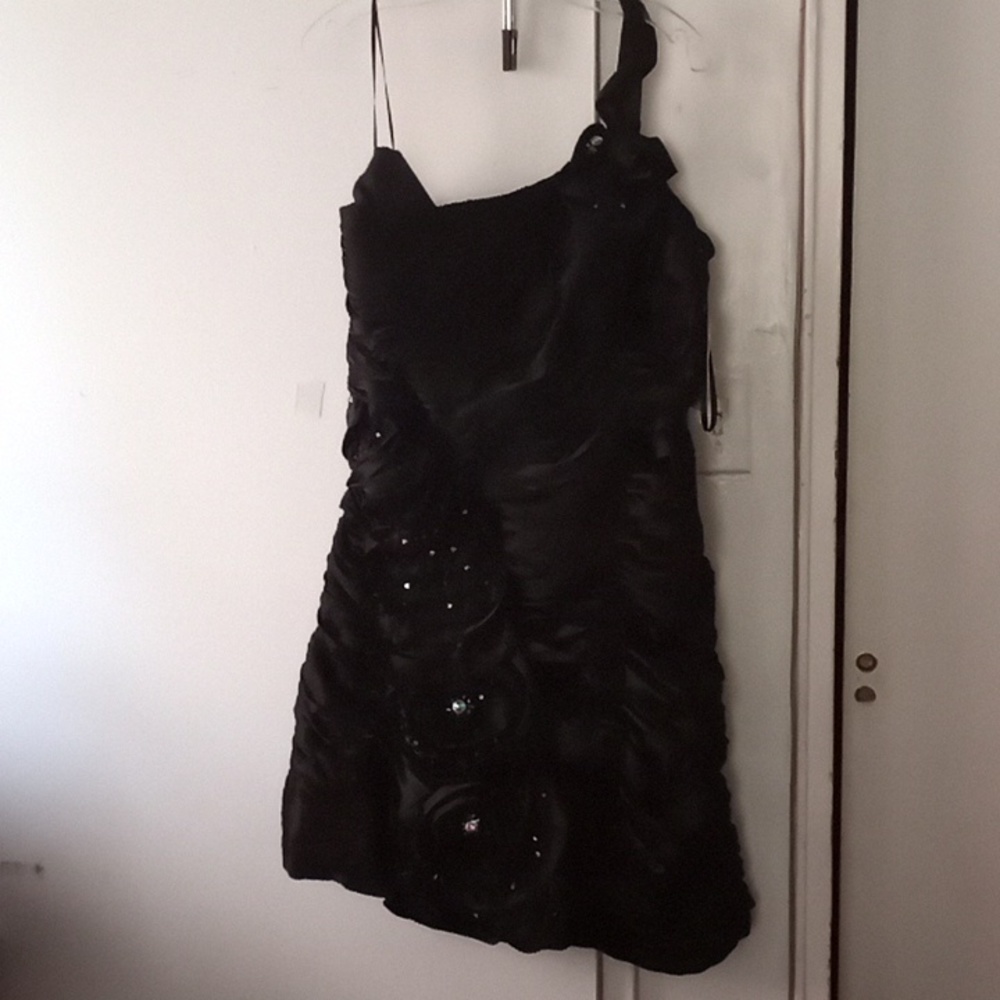 Brand new, little black dress with beautiful details